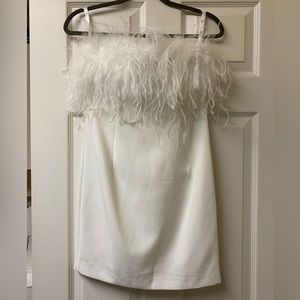 Strapless white mini dress with feathers